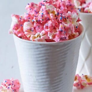 This Animal Cracker Popcorn is easy to make and a total crowd pleaser! From the Party Popcorn Cookbook