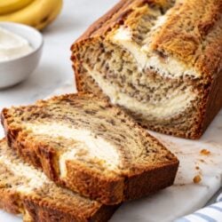 This banana bread cream cheese combo is moist, thick, and topped with dreamy frosting & pecans. The best banana bread you'll ever make!