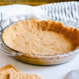 This perfect, delicious, buttery Graham Cracker Pie Crust is so simple to make and a must-have at your Thanksgiving pie table.