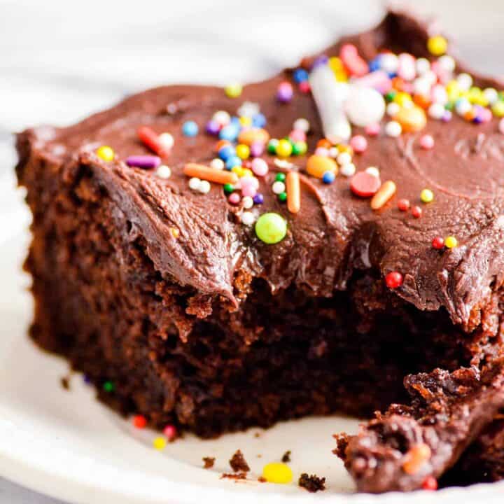 The Best Doctored Up Cake Mix Cake is the BEST CAKE OF ALL TIME EVER. Moist, fluffy, and topped with a supremely fudgy chocolate frosting.