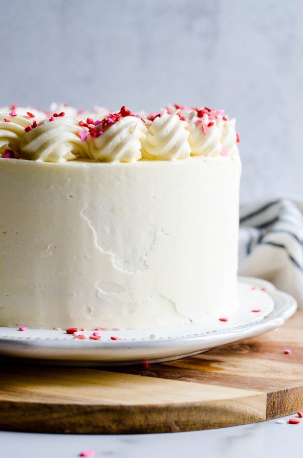 This Red Velvet Cake with White Chocolate has three layers of delicious, moist red velvet cake filled and frosted with white chocolate buttercream.