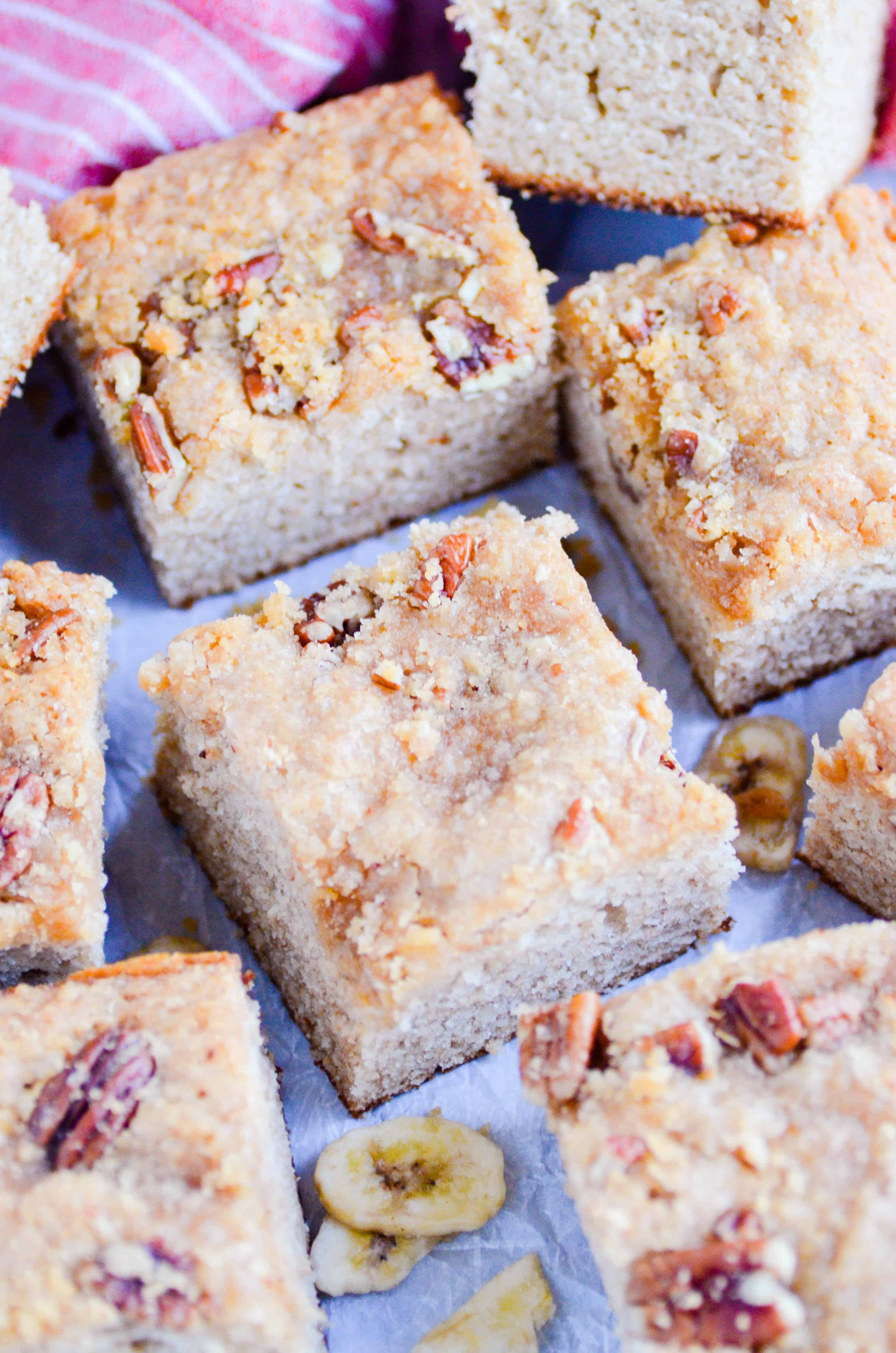 Soft banana cake made with Greek yogurt, bananas, whole wheat flour, coconut oil, and topped with a brown sugar pecan crumble. Nutritious enough for breakfast, and delicious enough for dessert!