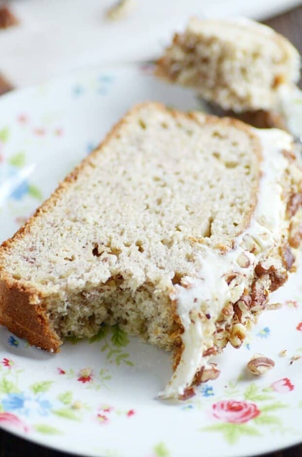 My favorite classic banana bread recipe smothered in cream cheese frosting and chopped pecans.