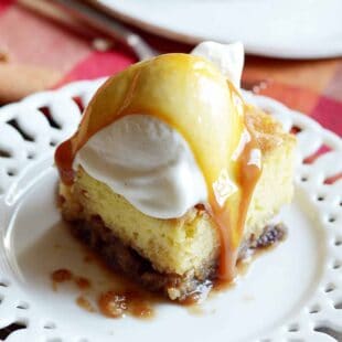 Supremely moist and tender cake with a crackly brown sugar top and pecan pie on the bottom. This cake is the ultimate Thanksgiving cake!