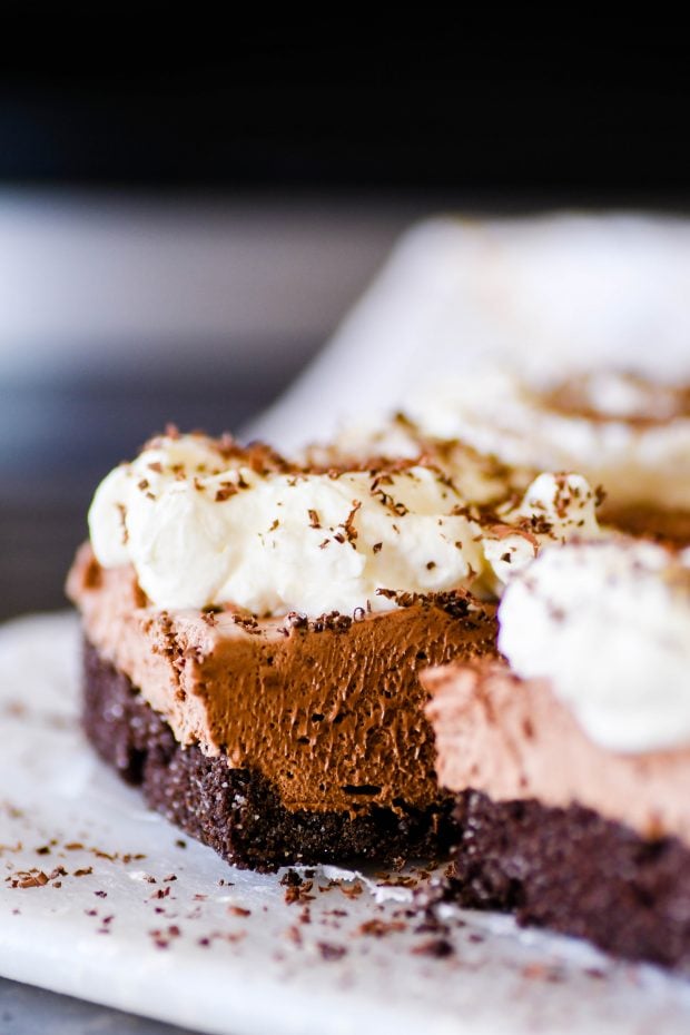 These French Silk Pie bars have a delicious chocolate graham cracker crust with a creamy, yet light-as-air, chocolate mousse filling.