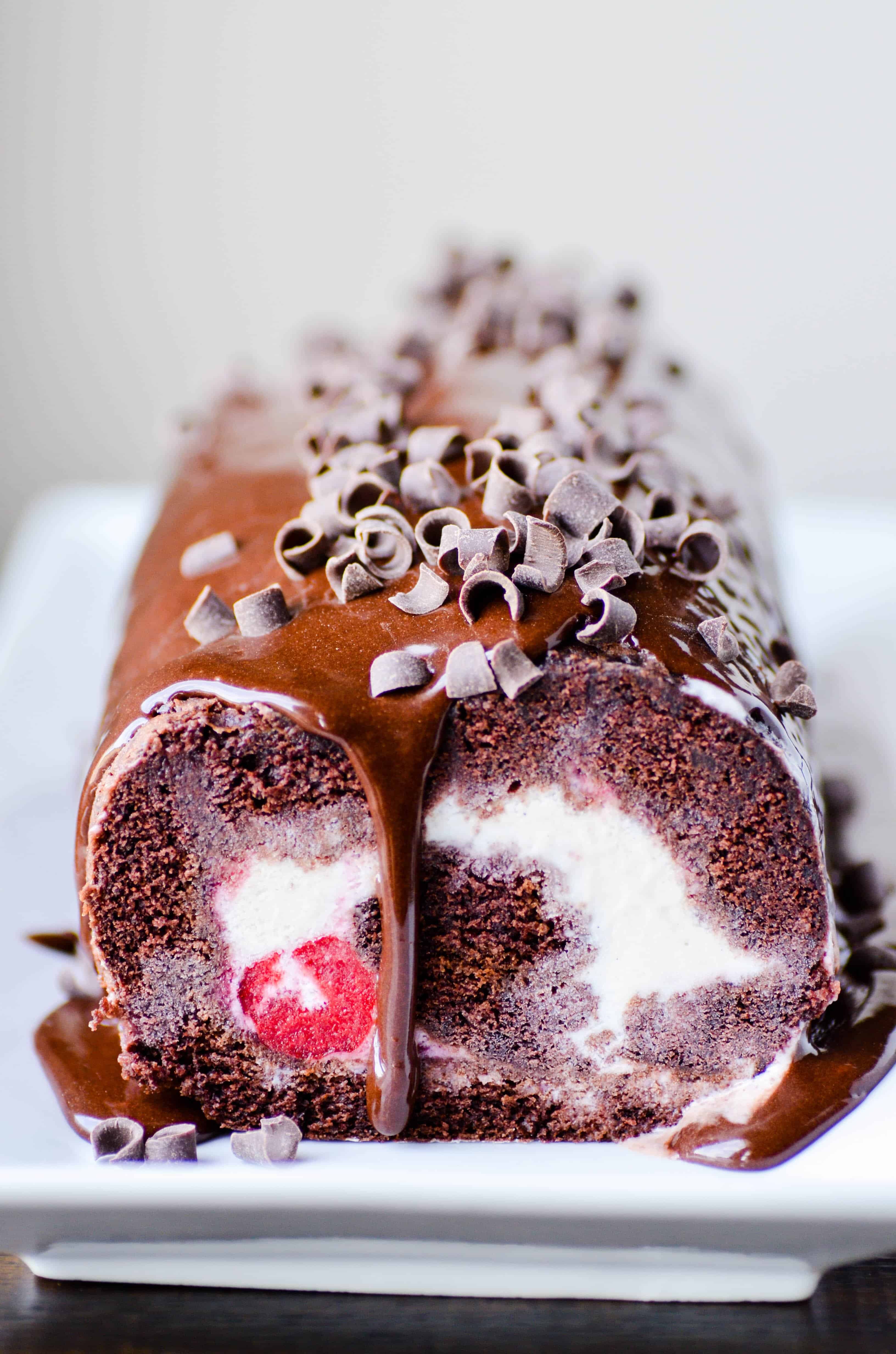 This Black Forest Ice Cream Cake is a fun "twist" on a classic cake. Chocolate cake is layered with vanilla ice cream, cherry pie filling, and topped with chocolate ganache.