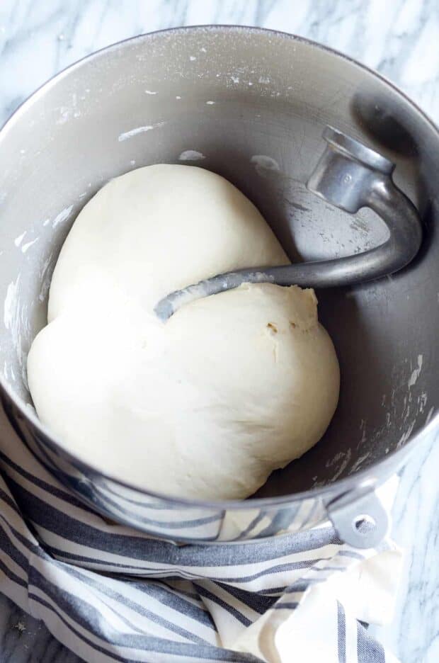 This easy and quick bread dough recipe is ready in less than 30 minutes. It's perfect for pizza crusts, cinnamon rolls, and even dinner rolls when you're in a pinch for time!
