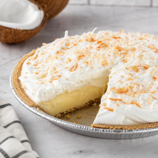 This homemade coconut cream pie has three dreamy from-scratch layers — and you can make each one ahead of time. So easy, so delicious! 🥥