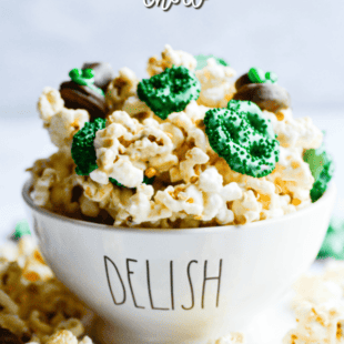 Leprechaun Chow is a fun and festive St. Patrick's day treat! Made with white chocolate coated kettle corn and rice cereal with candy coated pretzel "clovers".